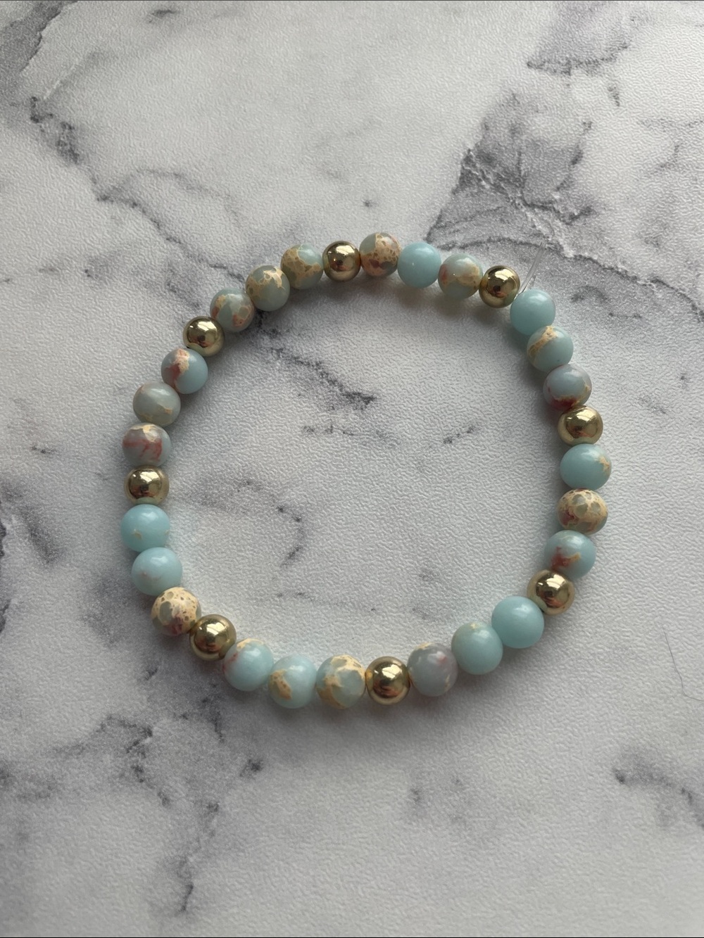 Natural stone, hand beaded elastic bracelet. 7 inches.